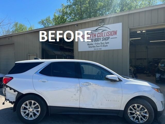a white suv is parked in front of a building that says before at Forsyth Collision in Cumming GA