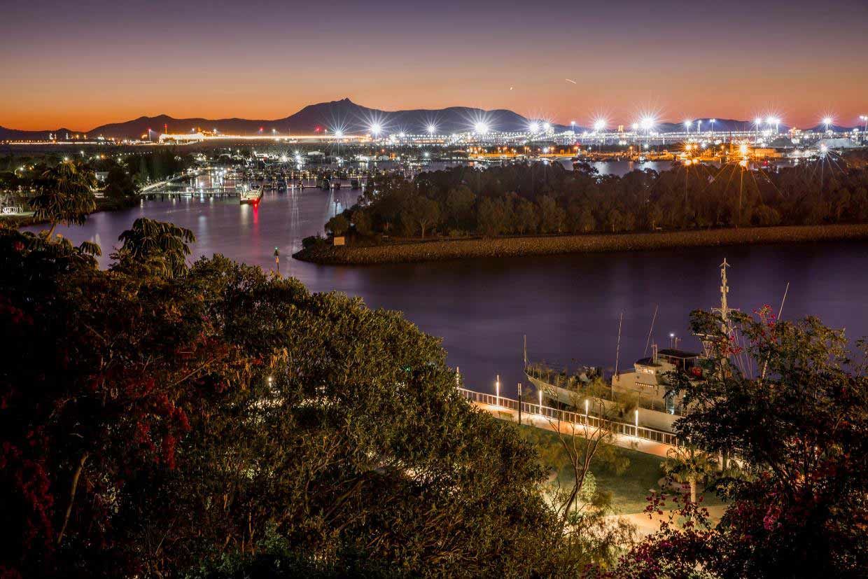 Night View of a Harbor With Bright Lights, a River, Trees, and a Dark Sky at Dusk — A1 Loco's Towing in Gladstone, QLD