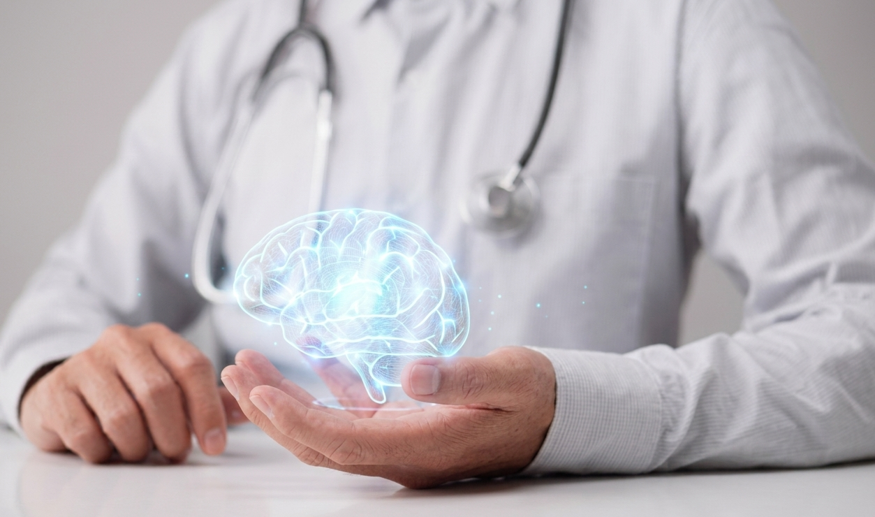 Doctor holding glowing digital brain hologram representing neurology and brain health care. Doctor holding glowing digital brain hologram representing neurology and brain health care.