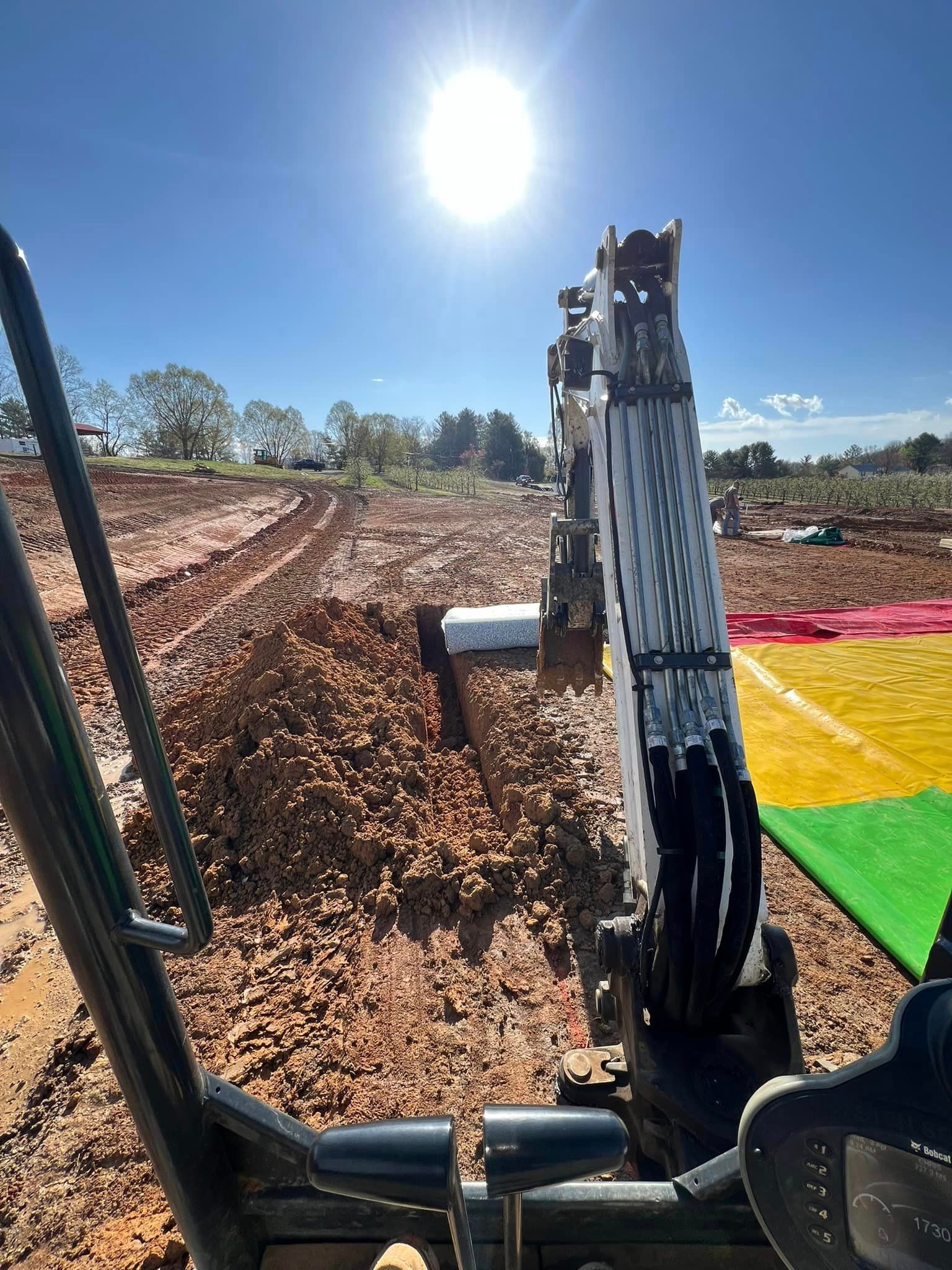 A person is riding a bike on a dirt road.