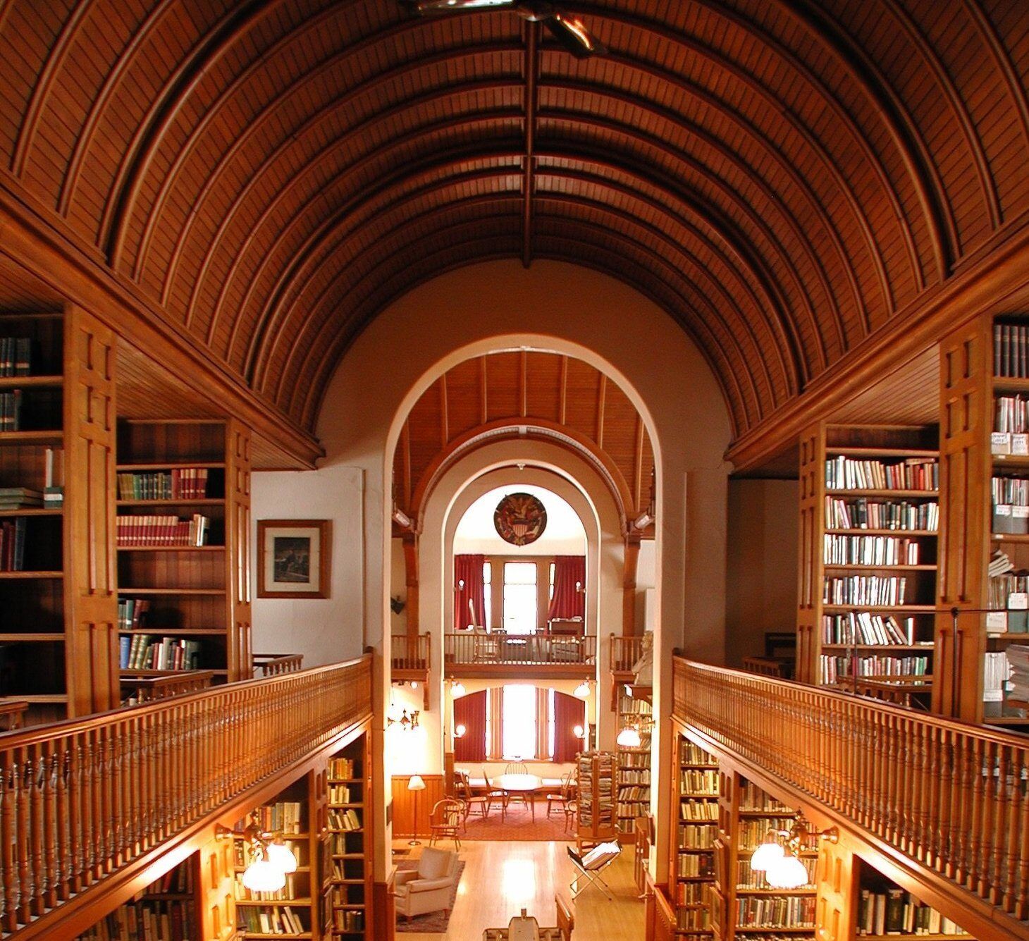 A library with arched ceilings and lots of books