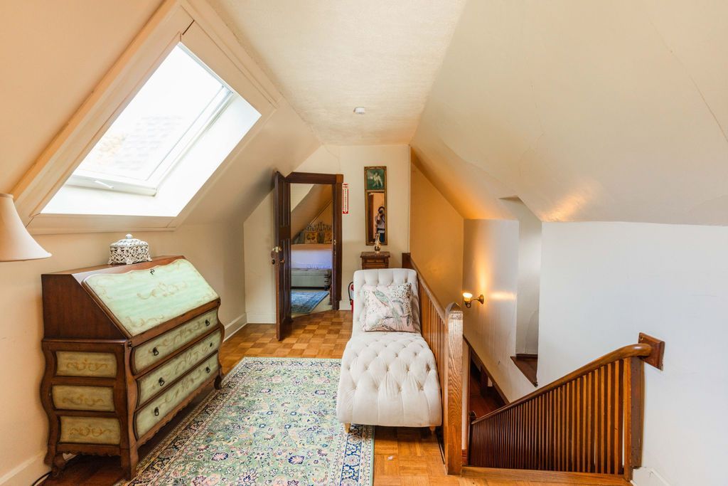 A room with a dresser and a chair in it