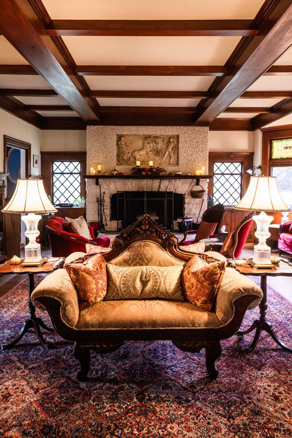 A living room filled with furniture and a fireplace.