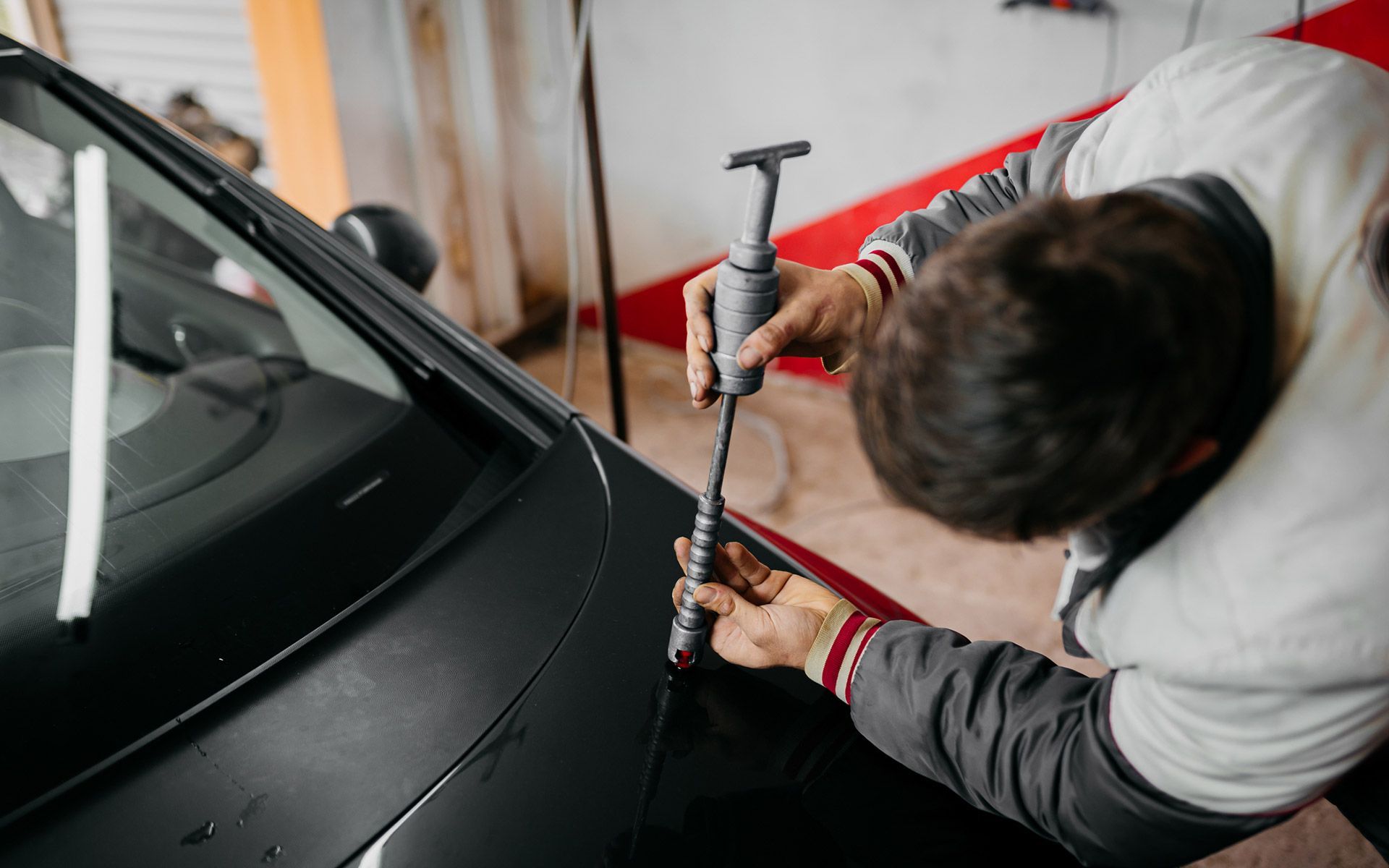 Man Working — Haltom City, TX — Dent Mechanix