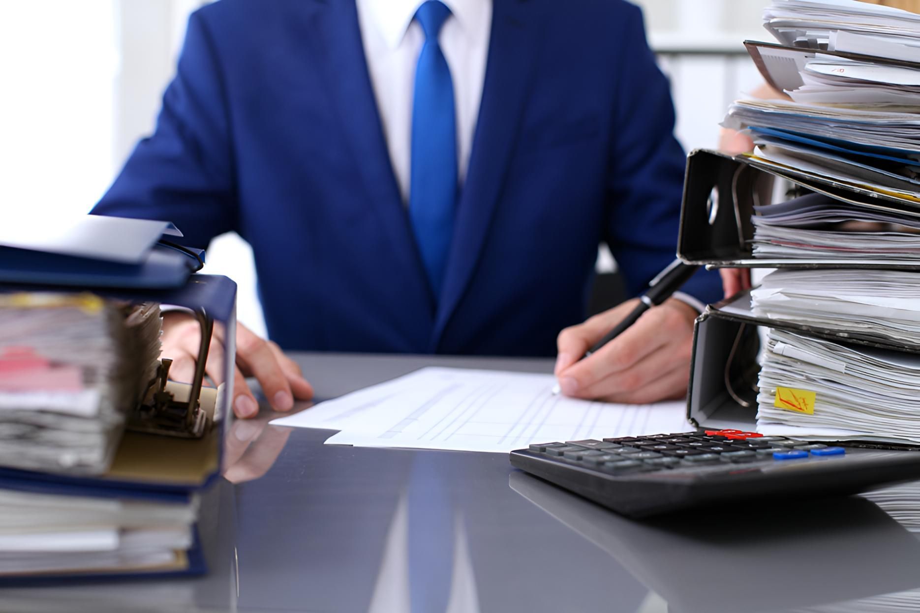 Man Working in Bookkeeping — Darling Downs Bookkeeping Company in Gatton, QLD