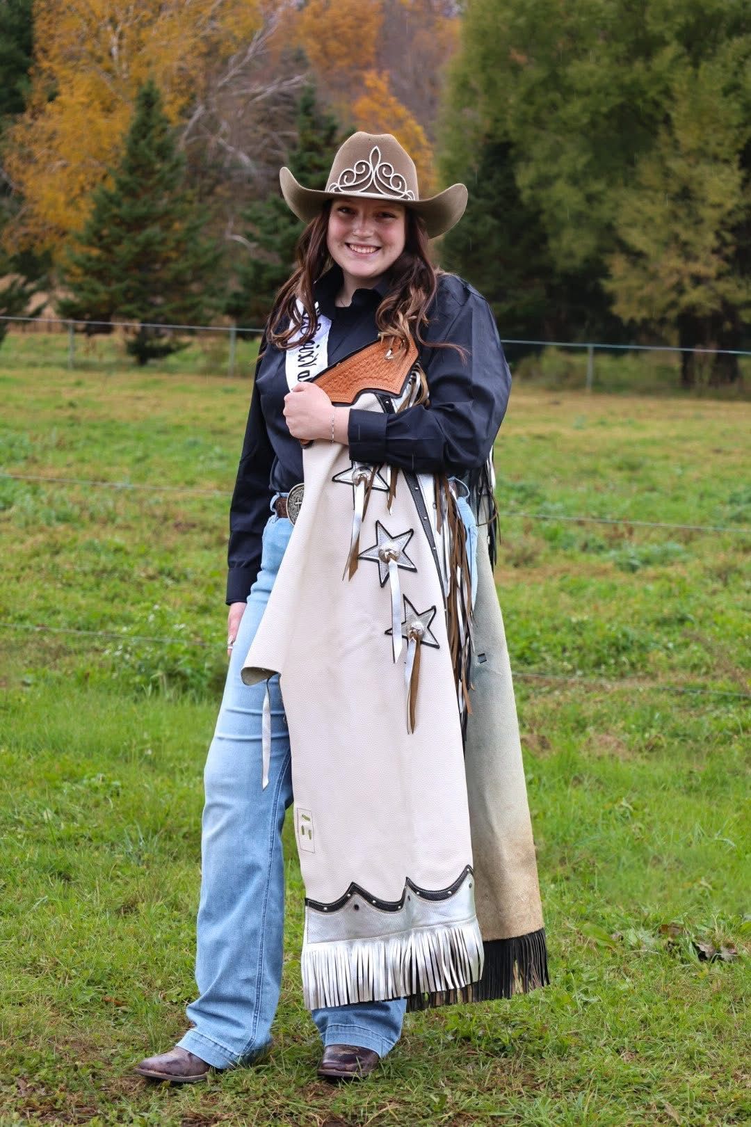 Woman holding ribbon and basket of items, standing in front of floral display. Poster reads 'Digging Local'.