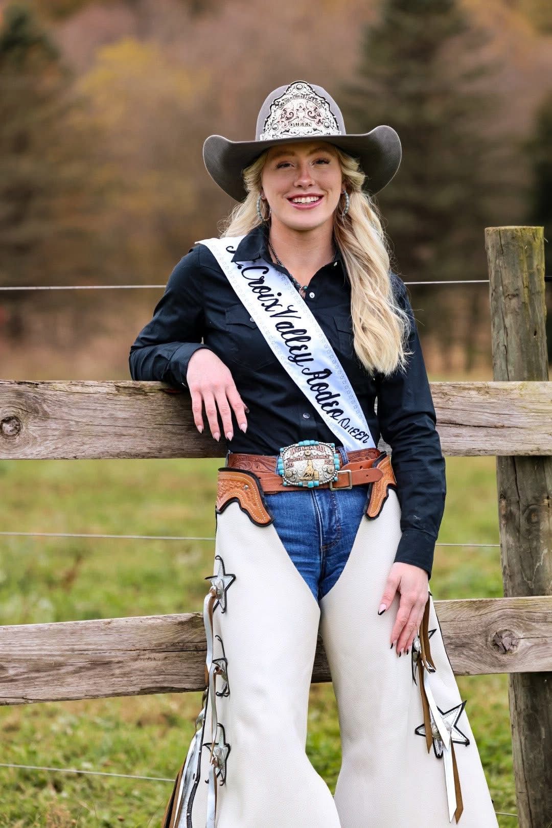 Woman holding ribbon and basket of items, standing in front of floral display.  Poster reads 'Digging Local'.