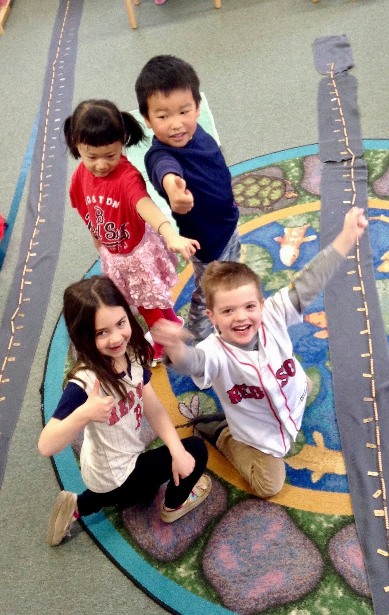 A group of children are posing for a picture