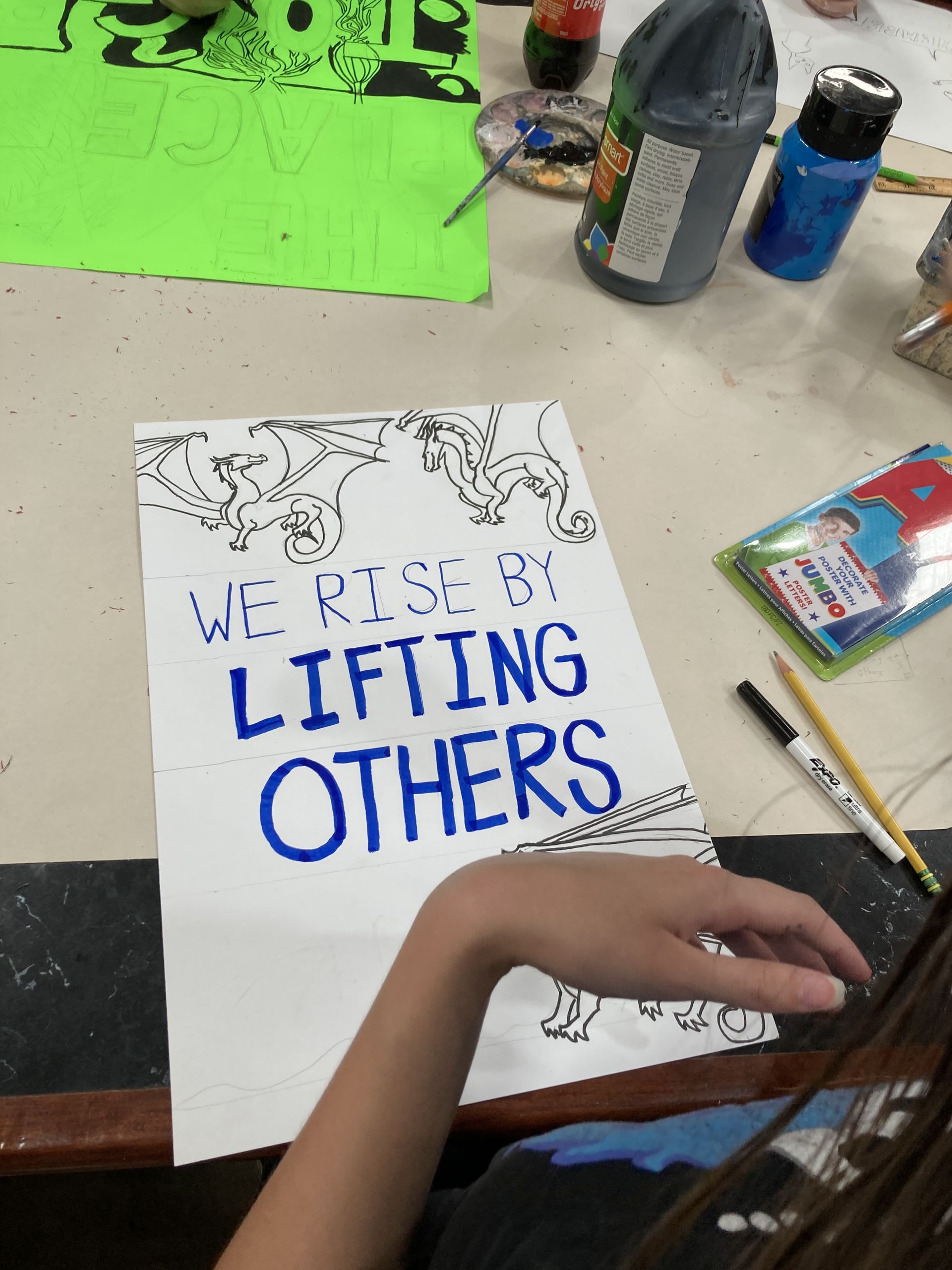 Poster making process: We Rise by Lifting Others