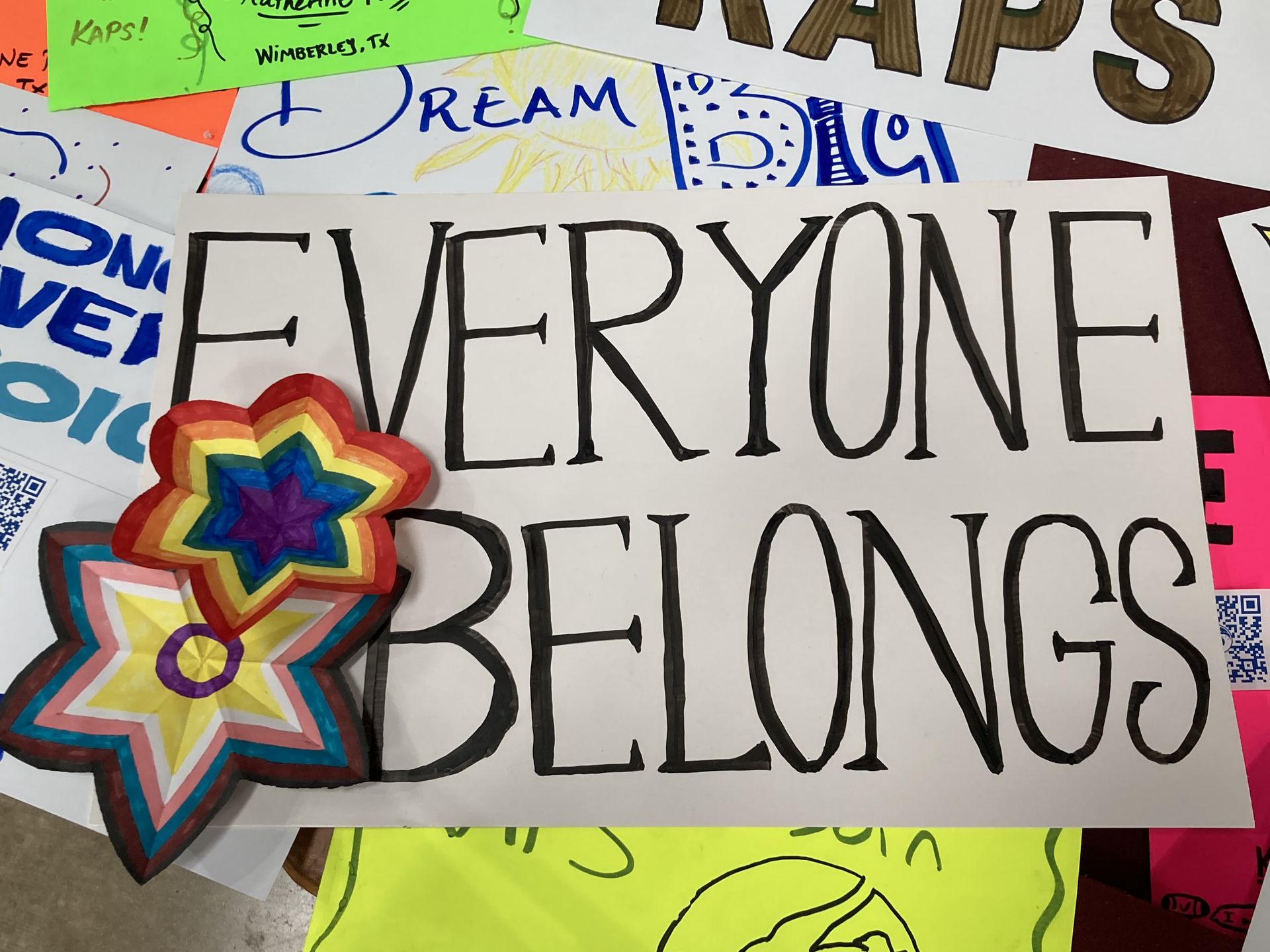 “Everyone Belongs” and other posters by KAPS students.