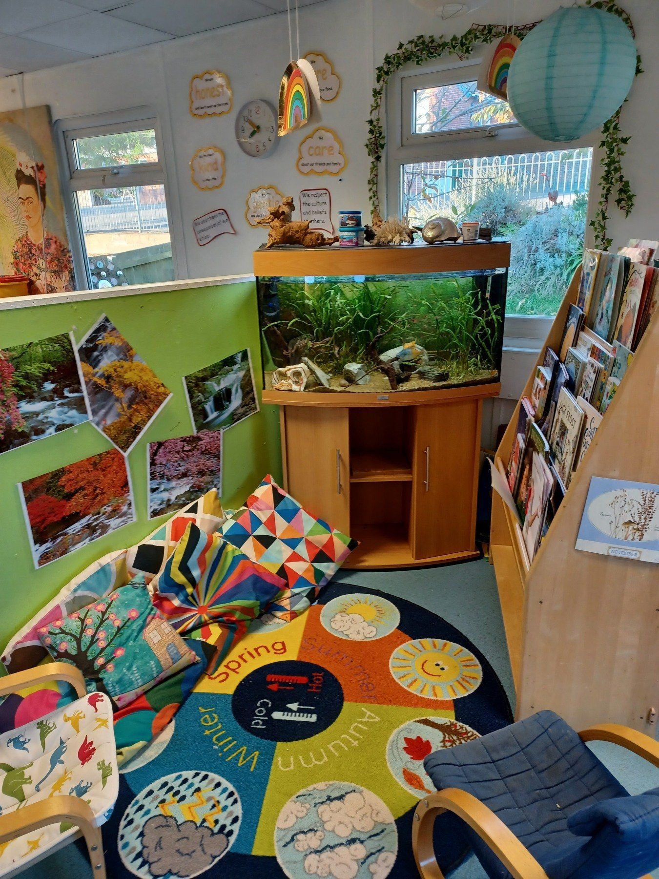 There is a fish tank in the middle of the room.