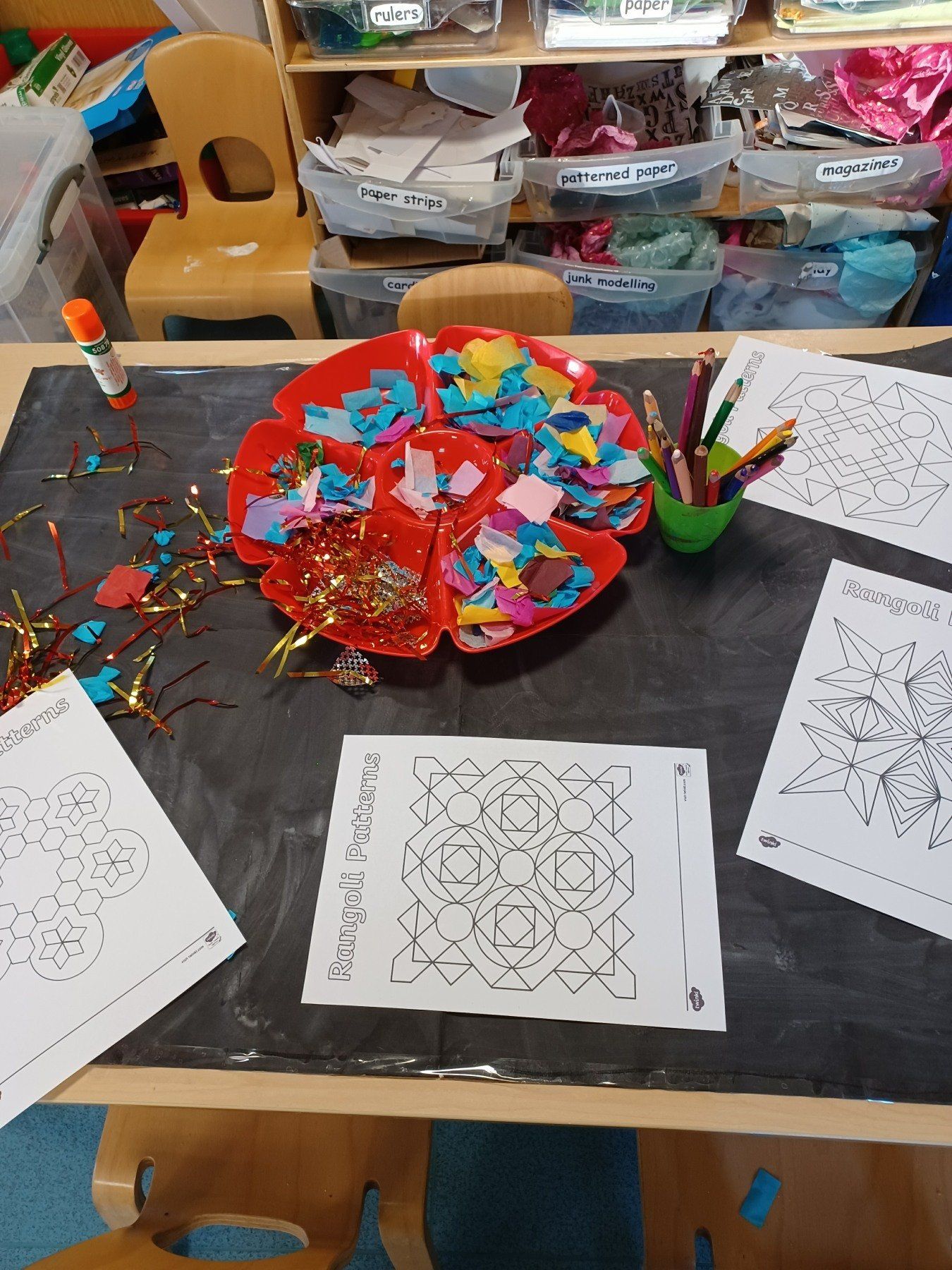 A table with papers and a bowl of confetti on it