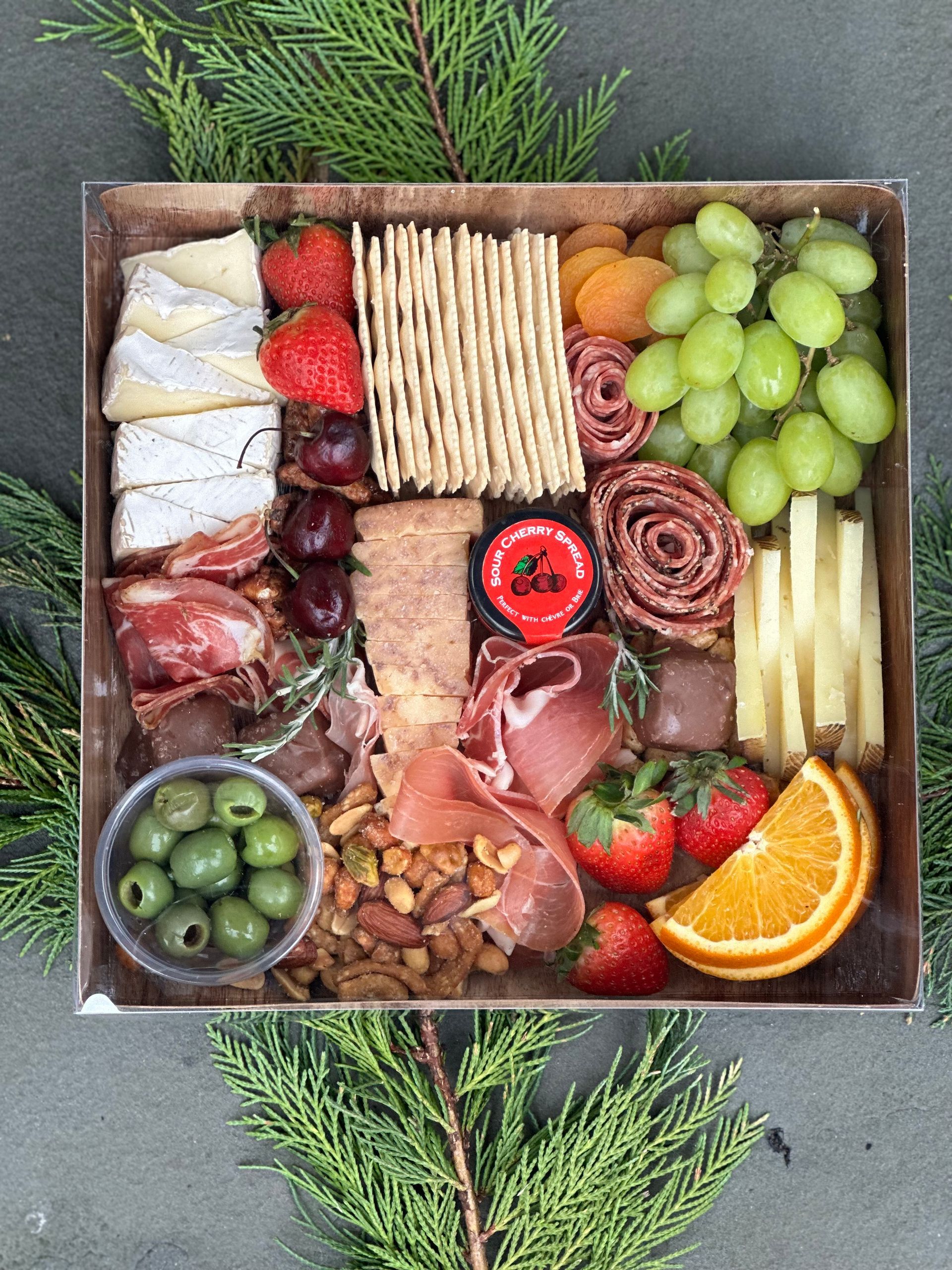 chocolates, meats and crackers with fruit