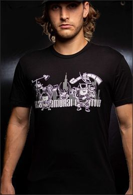Man in black t-shirt featuring a stylized graphic of city skyline with the words "Sea Samurai Time".