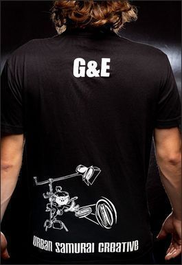 Black t-shirt with "G&E" and a technical drawing, "Urban Samurai Creative," on the back.