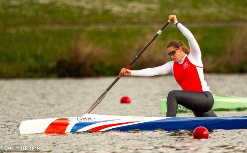 Paddle Northern Ireland | A woman is kneeling down in a kayak holding a paddle