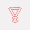 An icon of a medal on a white background.