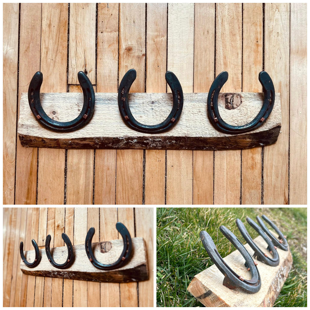 Three horseshoes are sitting on a piece of wood