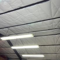 A ceiling with a lot of lights hanging from it.