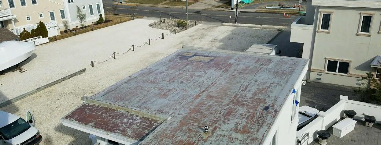 An aerial view of a building with a rusty roof
