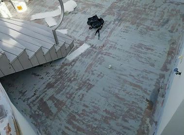 A concrete floor with stairs and a camera on it