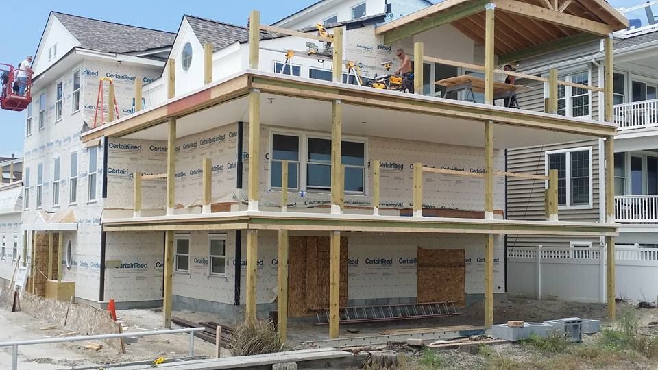 A large white house is being built on stilts