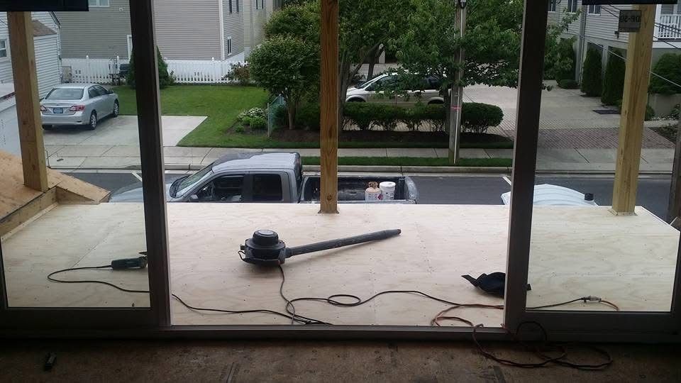 A truck is parked in the driveway of a house