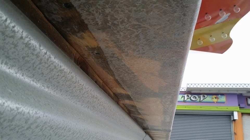 A building with a purple sign that says pop on it