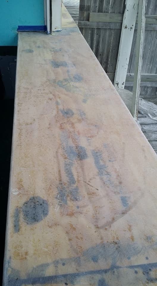 A close up of a piece of wood with stains on it