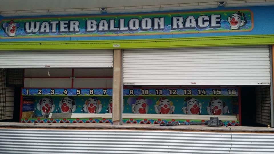 A building with a sign that says water balloon race