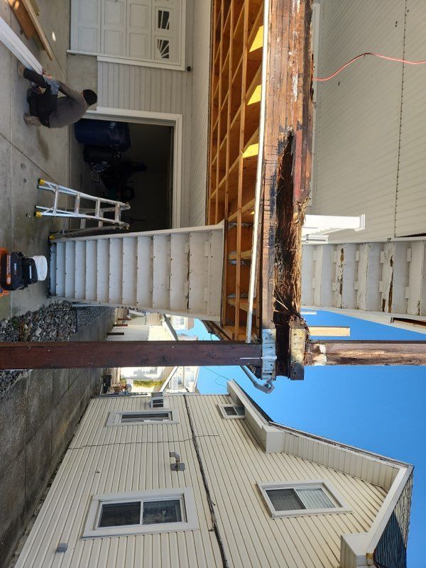A staircase is being built in the backyard of a house