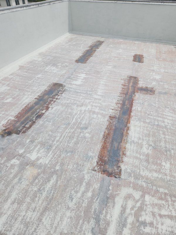 A close up of a roof with a lot of rust on it