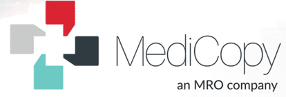 A smiling doctor in a lab coat with a stethoscope around his neck.