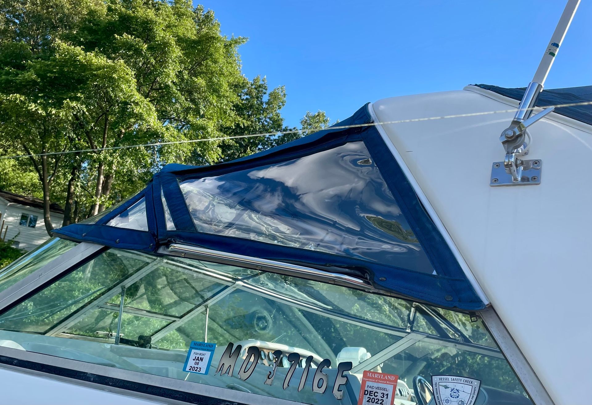 A close up of a boat with a license plate that says ' nc ' on it. | Cordova & Pasadena, MD | Shoreline Awning & Trim