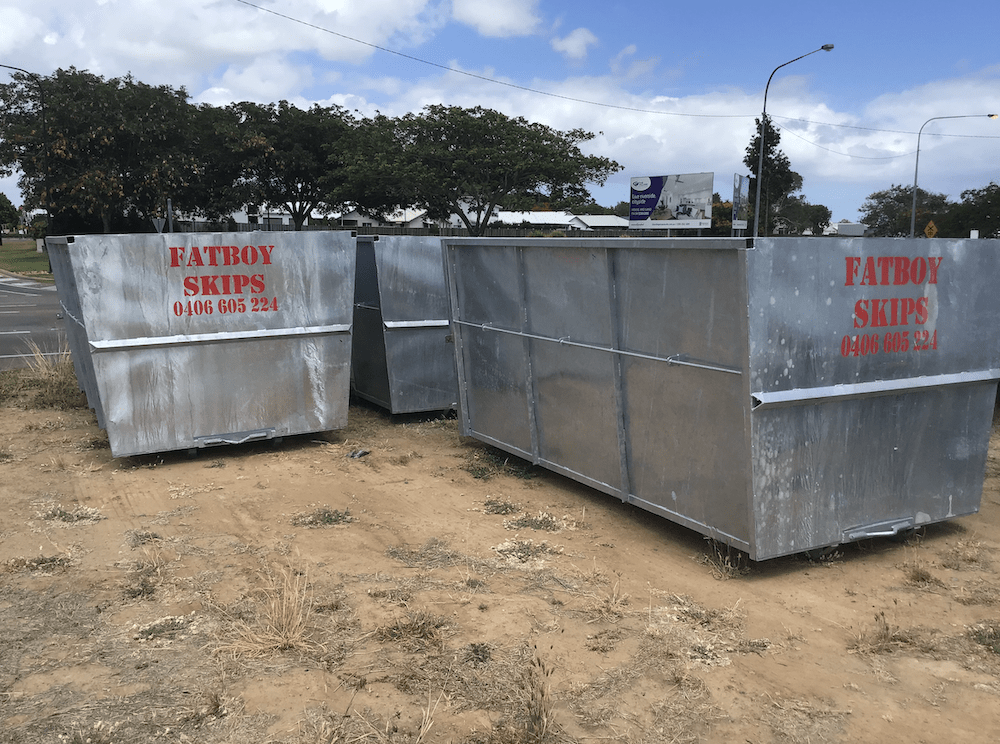 Loading Skip Bins on the Truck — Rubbish Removal in Nome, QLD