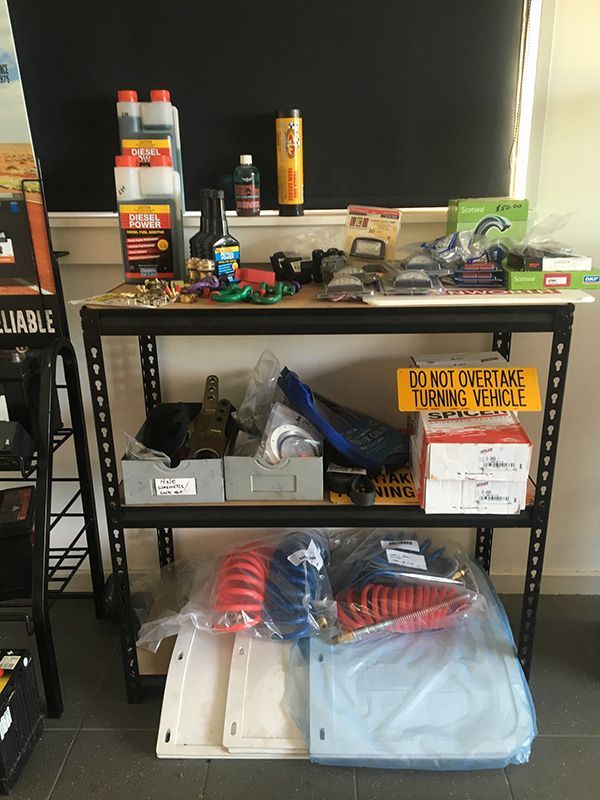 A Shelf Filled with A Variety of Motorcycle Parts — Fletcher's Truck and 4WD Repair Centre in Forster, NSW