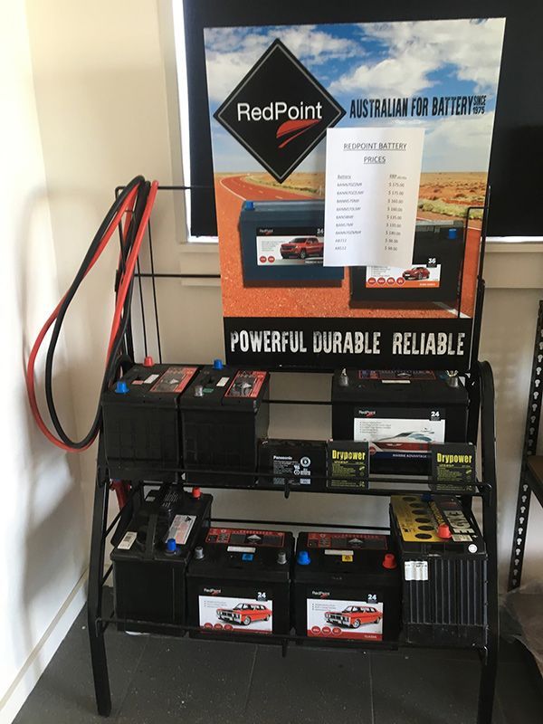 Batteries with A Sign that Says Powerful Durable Reliable — Fletcher's Truck and 4WD Repair Centre in Forster, NSW