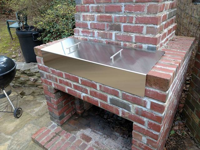 Outdoor firepit with metal cover