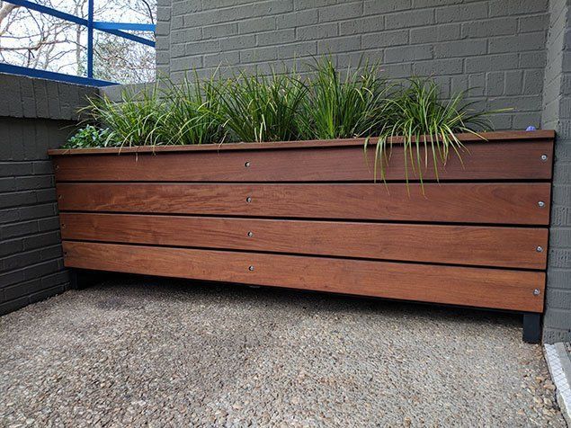 Retaining wall with wooden support