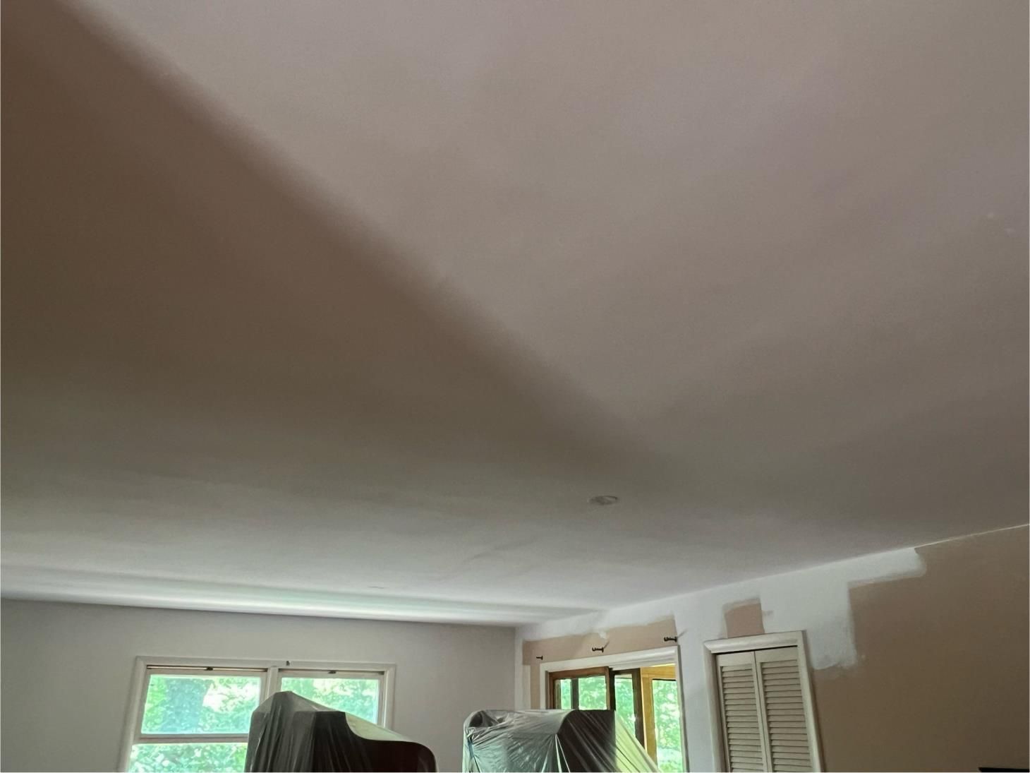 a vacuum cleaner sits in a room that is being remodeled
