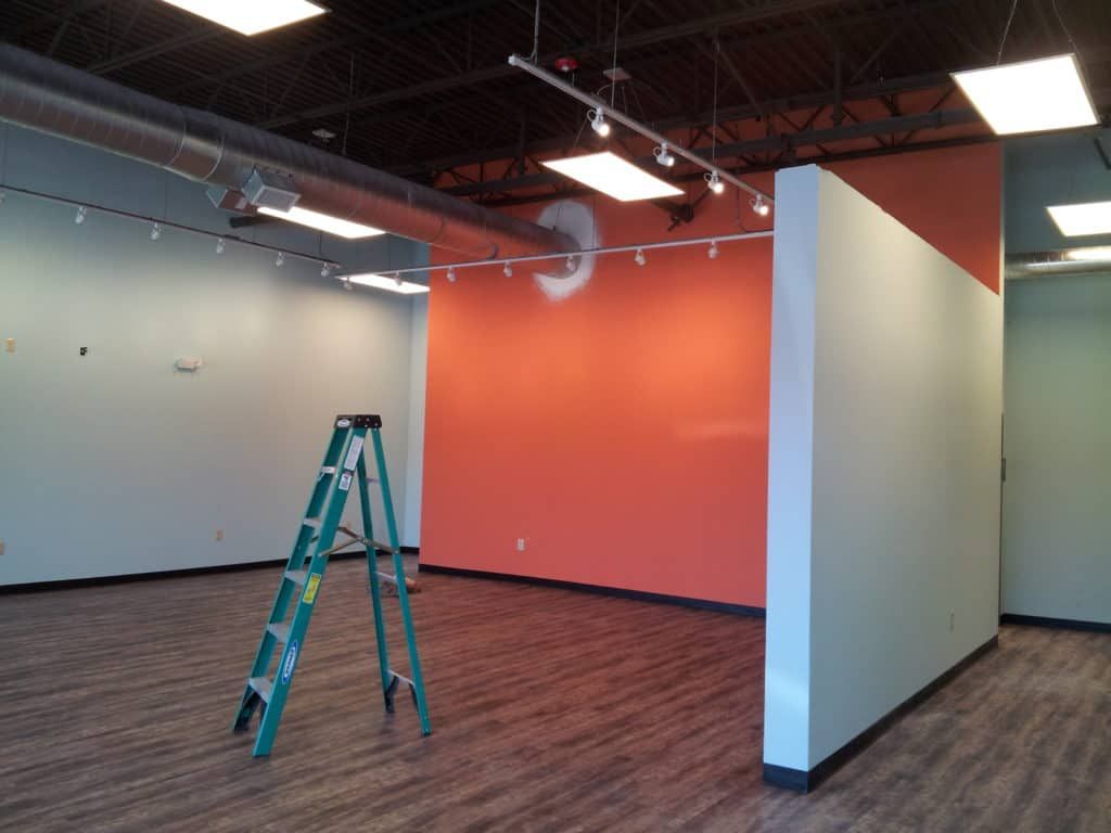 a vacuum cleaner sits in a room that is being remodeled
