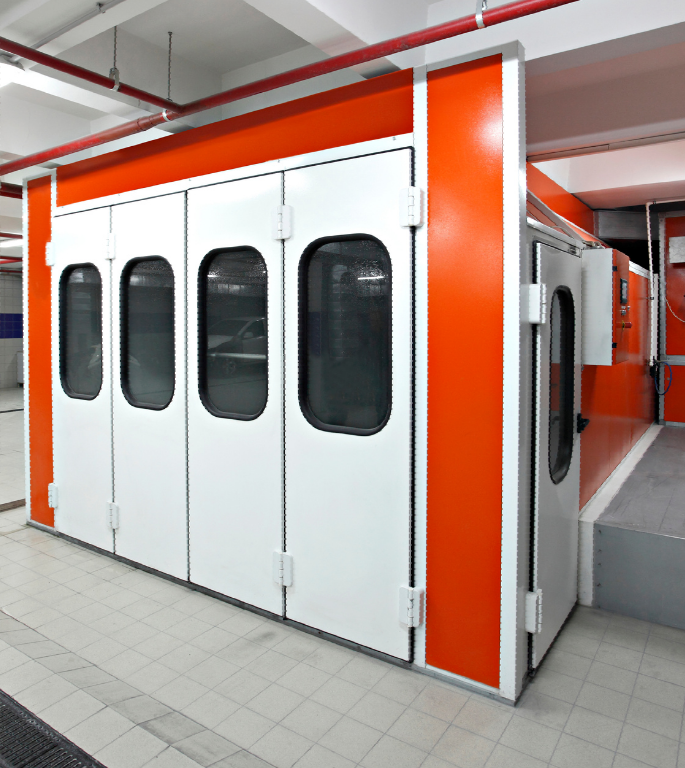 A room with orange walls and white doors