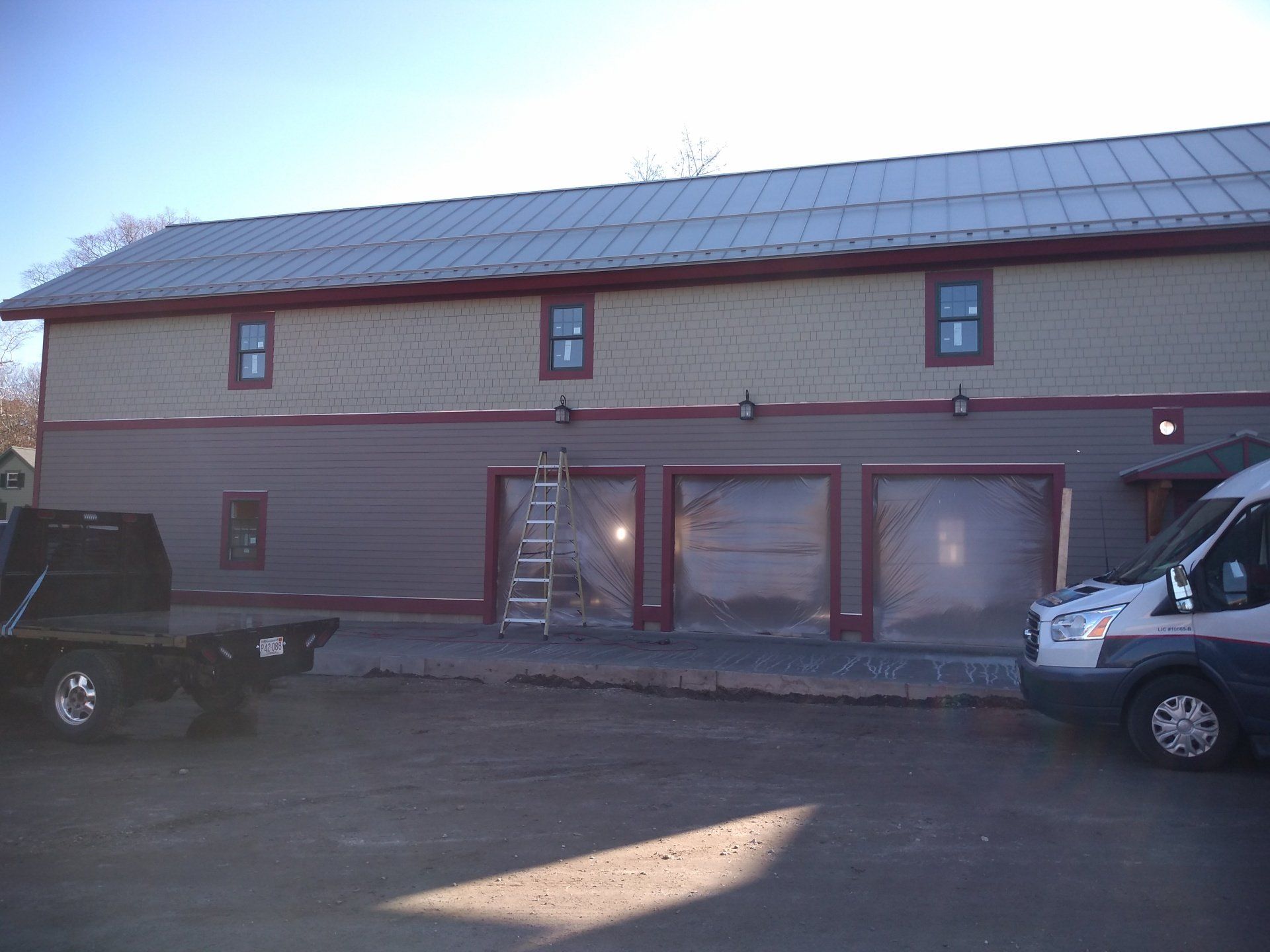 a building with a ladder and electric lights