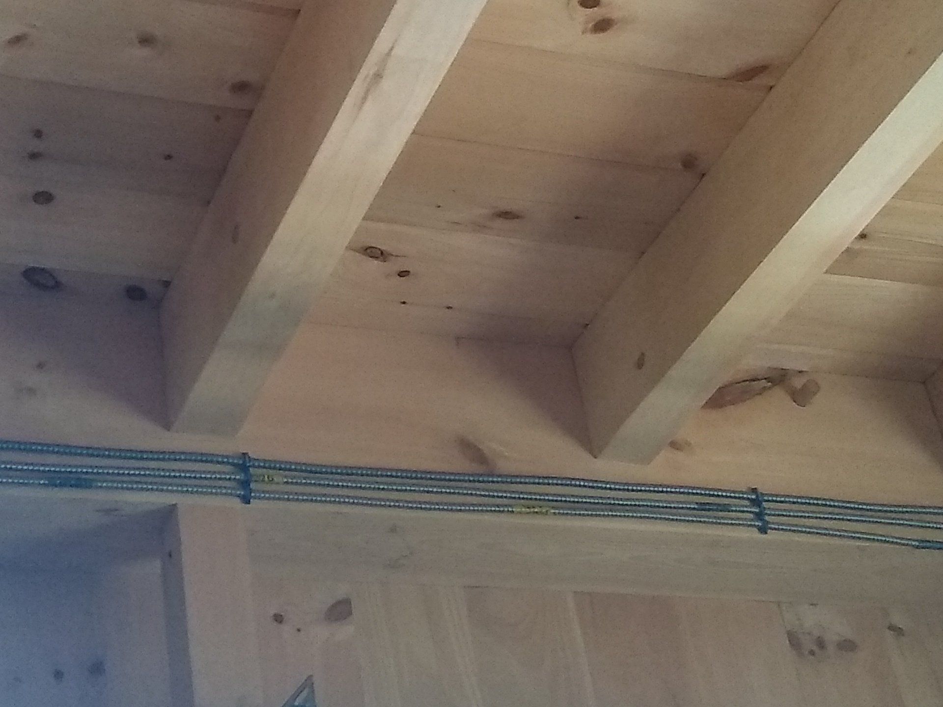 a close up of a wooden ceiling with beams