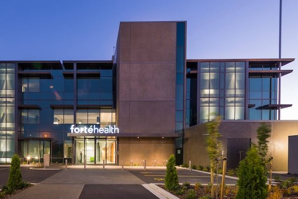 A large building with a sign that says fortehealth