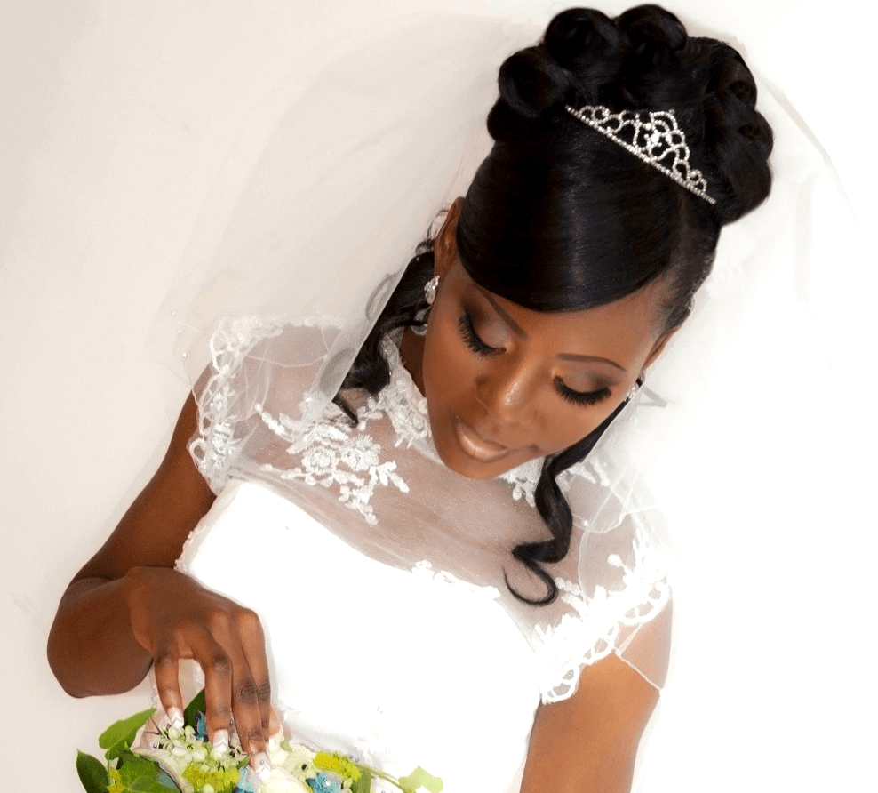 Bridal updo on black African Caribbean bride in London. Makeup for black skin.