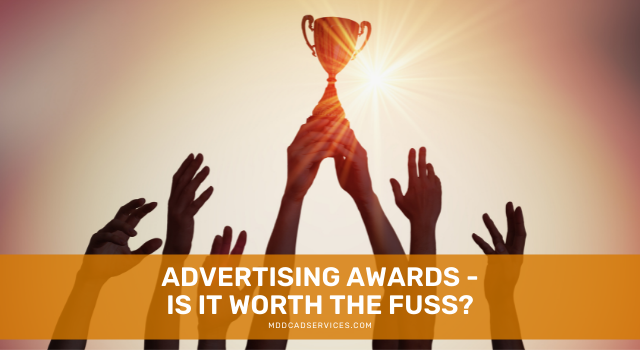 Multiple hands reach upward toward a trophy against a sunset background, with the text: 