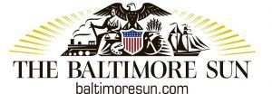 The Baltimore Sun logo featuring an eagle, a shield, a locomotive, and a ship above the newspaper's name and website.