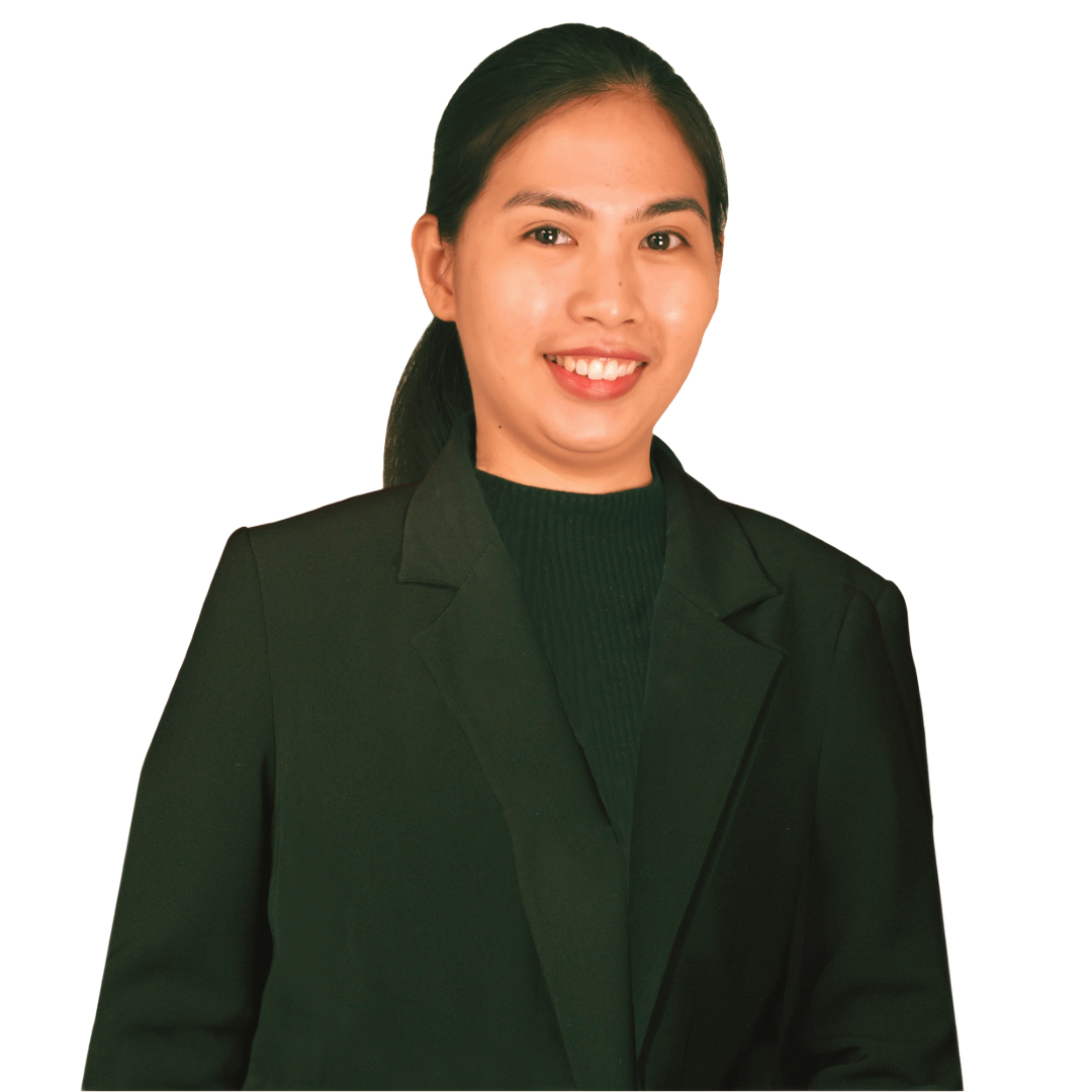 A person smiling while wearing a dark blazer over a dark sweater, set against a plain, light background.