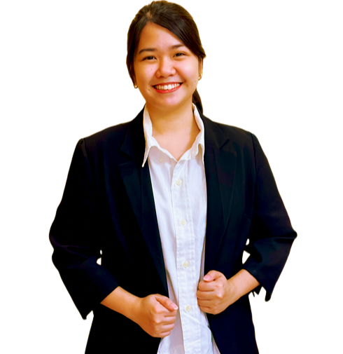 A smiling person wearing a white button-down shirt and a black blazer against a plain white background.